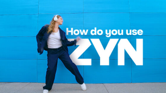 ZYN COOL MINT - an open, light blue nicotine pouch can with 2 pouches next to it