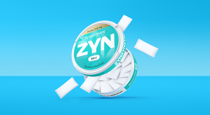 Two women hugging and a third women looking at them and smiling