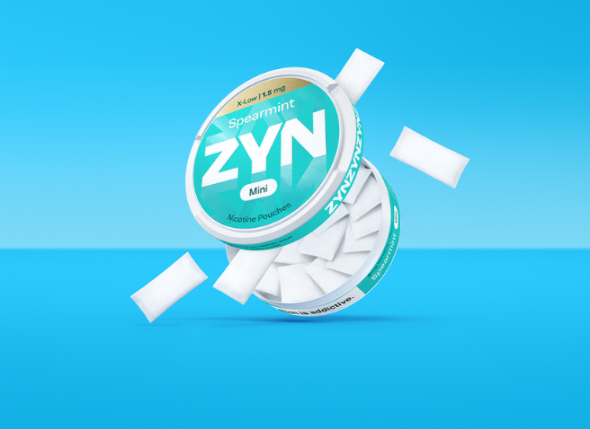 Two women hugging and a third women looking at them and smiling